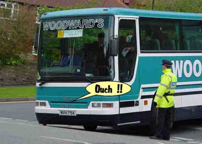 bus grounded on dip in road